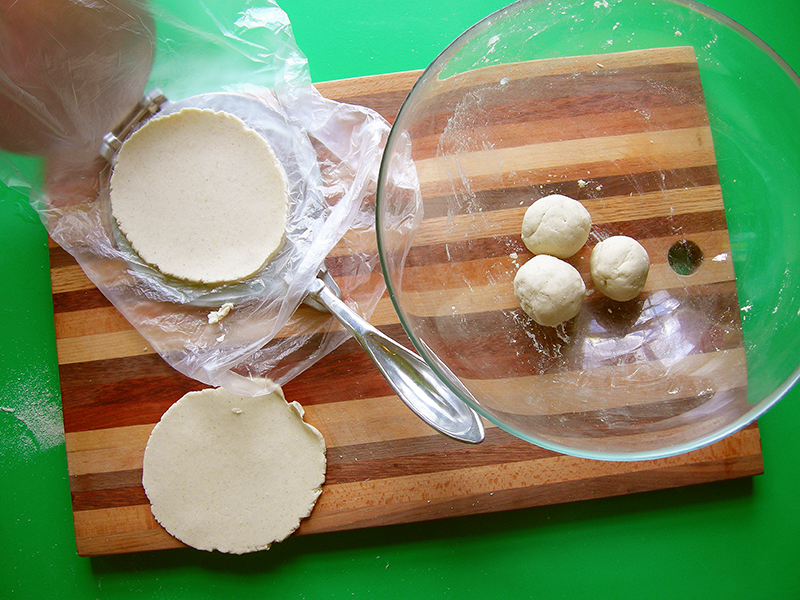 East Van Kitchen's homemade tortillas, using masa harina, a pinch of salt and a sprinkle of water! Cover your tortilla press in a plastic bag, so your homemade tortillas can be peeled off easily.